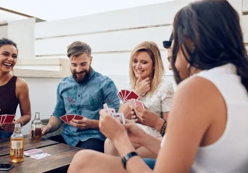 A group of friends playing spades