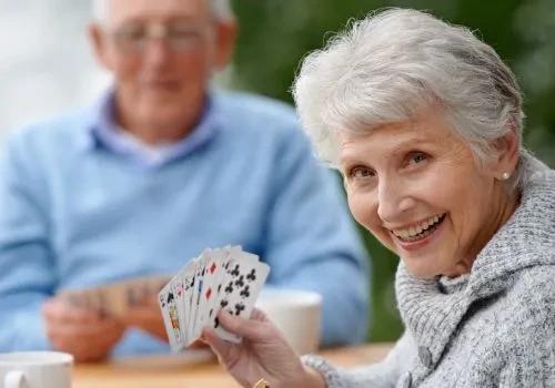 Two elderly playing classic two-player card games