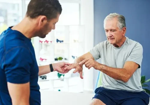 A man with arthritis attending a doctor's appointment